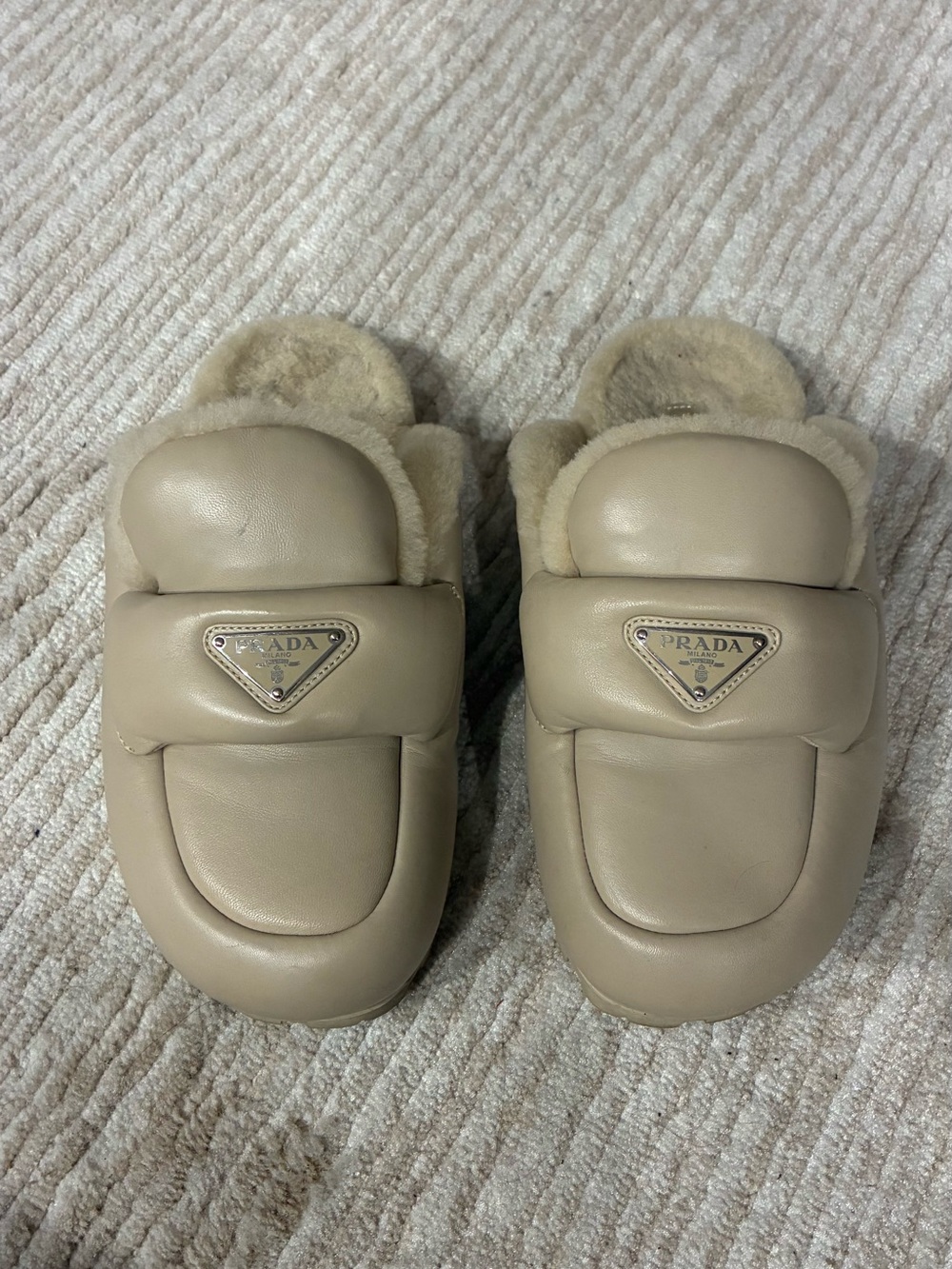 Prada enameled metal triangle leather shearling mules